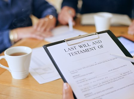Group of people sat in a room watching a man present stood up