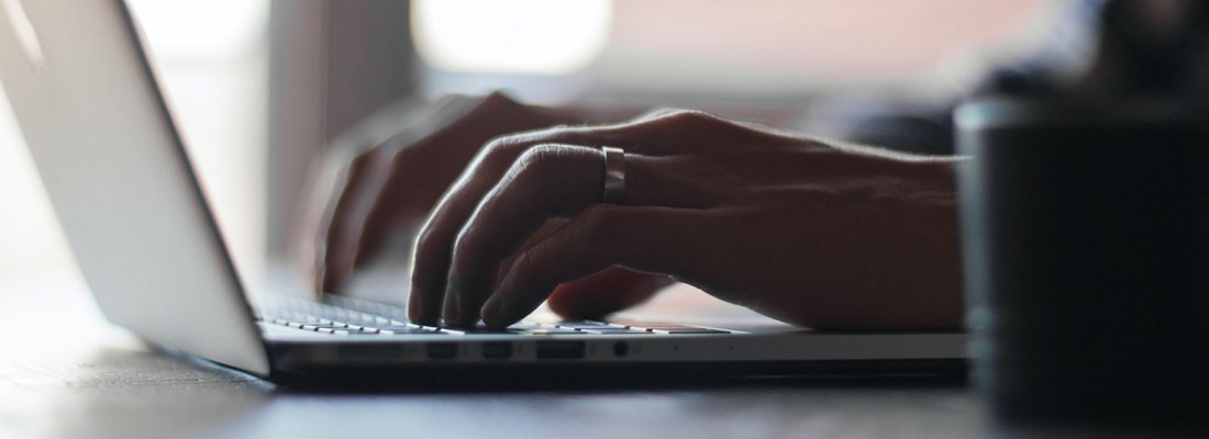 Man typing on a laptop